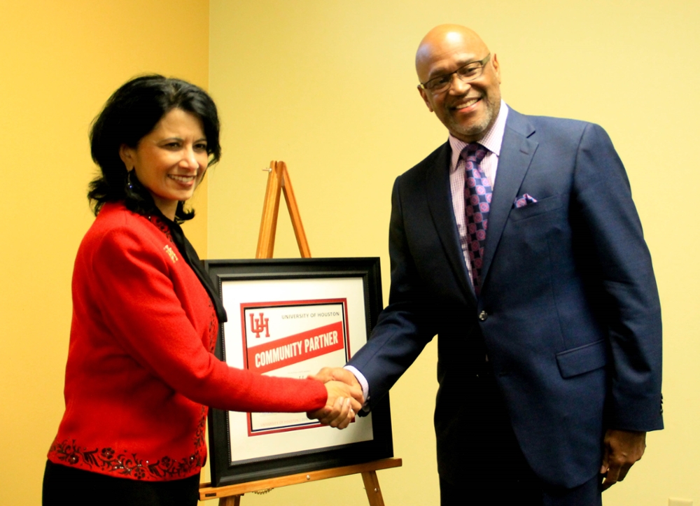 President Renu Khator presents Community Partner Award to Recipient Reverend Leslie Smith